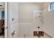 Bathroom with white tile and needs renovation at 43 Leeward Is, Clearwater Beach, FL 33767