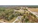 Aerial view showcasing a house with a large lot and surrounding trees at 4367 Burns Rd, Brooksville, FL 34602