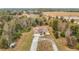 Aerial view showing a single-Gathering house with a large yard and driveway at 4367 Burns Rd, Brooksville, FL 34602