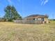 Large backyard with home and wooden fence at 4367 Burns Rd, Brooksville, FL 34602