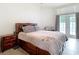 Bright bedroom with a comfortable bed and patio doors at 4367 Burns Rd, Brooksville, FL 34602