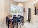 Bright dining area with table and chairs near sliding glass doors at 4367 Burns Rd, Brooksville, FL 34602