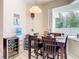 Bright kitchen nook with table and chairs, offering a view of the backyard at 4367 Burns Rd, Brooksville, FL 34602