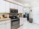 Modern kitchen with stainless steel appliances and white cabinets at 4367 Burns Rd, Brooksville, FL 34602