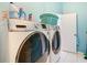 Bright laundry room with washer and dryer at 4367 Burns Rd, Brooksville, FL 34602