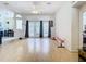 Living room featuring hardwood floors, sliding glass doors, and access to the pool area at 4367 Burns Rd, Brooksville, FL 34602