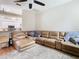 Spacious living room featuring a large sectional sofa and a view of the kitchen at 4367 Burns Rd, Brooksville, FL 34602