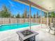 Spacious patio with fire pit near pool at 4367 Burns Rd, Brooksville, FL 34602