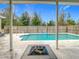 Covered patio with fire pit overlooking pool at 4367 Burns Rd, Brooksville, FL 34602