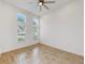 Spacious bedroom with light wood flooring and large windows at 5307 Wishing Arch Dr, Apollo Beach, FL 33572