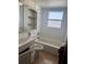 Bathroom with a bathtub, toilet and sink at 6809 N Boulevard, Tampa, FL 33604