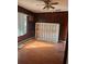 Empty bedroom with wood walls and laminate flooring at 6809 N Boulevard, Tampa, FL 33604