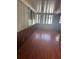 Sunroom with wood walls and laminate flooring at 6809 N Boulevard, Tampa, FL 33604