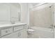 Clean bathroom, featuring a white vanity, bathtub, and tiled shower at 9430 Shorebird Ct, Parrish, FL 34219