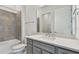 Modern bathroom boasts gray vanity and tiled shower/tub combo at 9433 Barnacle Ln, Parrish, FL 34219