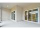 Covered patio features sliding glass doors and view at 9433 Barnacle Ln, Parrish, FL 34219