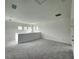 Spacious bonus room with multiple windows and grey carpet at 3033 54Th N Ave, St Petersburg, FL 33714