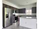 Modern kitchen with stainless steel appliances and granite countertops at 3033 54Th N Ave, St Petersburg, FL 33714