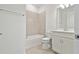 Clean bathroom with white vanity, tub, and neutral tile at 9461 Shorebird Ct, Parrish, FL 34219