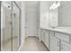 Bathroom with double vanity, quartz countertop, and glass shower at 9461 Shorebird Ct, Parrish, FL 34219