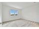 Spacious bedroom with gray carpet and large window at 9461 Shorebird Ct, Parrish, FL 34219