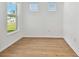 Bright office with large window, light wood floors, and neutral walls at 9461 Shorebird Ct, Parrish, FL 34219