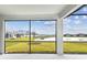 Screened porch overlooking a pond and community at 9461 Shorebird Ct, Parrish, FL 34219