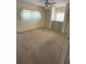 Bright bedroom with ample closet space and neutral carpeting at 37308 Kinkaid Dr, Zephyrhills, FL 33541