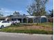 Front view of the house with driveway and landscaping at 4723 114Th N St, St Petersburg, FL 33708