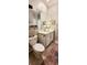 Clean bathroom with white vanity and a large mirror at 31422 Briars Ml, San Antonio, FL 33576