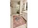 Clean bathroom with a walk-in shower and stylish rug at 31422 Briars Ml, San Antonio, FL 33576