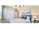 Bright bedroom featuring a double bed and spacious closet at 31422 Briars Ml, San Antonio, FL 33576