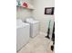 Laundry room with washer, dryer, and shelving at 31422 Briars Ml, San Antonio, FL 33576