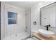 Modern bathroom, subway tile, floating vanity, and updated fixtures at 3170 6Th S Ave, St Petersburg, FL 33712