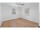 Well-lit bedroom with two windows and wood-look flooring at 3170 6Th S Ave, St Petersburg, FL 33712