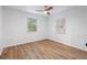 Spacious bedroom with ceiling fan and wood-look flooring at 3170 6Th S Ave, St Petersburg, FL 33712