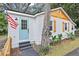 Updated home with light blue door and American flag at 3170 6Th S Ave, St Petersburg, FL 33712