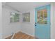 Laundry room with light walls and a blue door at 3170 6Th S Ave, St Petersburg, FL 33712