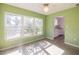 Sunlit bedroom with a large window, ceiling fan, and neutral carpet, offering a serene and inviting atmosphere at 422 86Th Ave, St Pete Beach, FL 33706