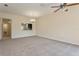 Spacious living room with a neutral palette, providing a versatile space for relaxation and entertainment at 13640 Eastfork Ln, Hudson, FL 34669