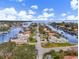 Aerial view of waterfront home with private dock and lush landscaping at 2000 Kansas Ne Ave, St Petersburg, FL 33703