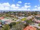 Bird's-eye view showcasing a canal-front home with neighborhood context at 2000 Kansas Ne Ave, St Petersburg, FL 33703