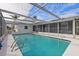 Refreshing turquoise pool, screened enclosure and canal view at 2000 Kansas Ne Ave, St Petersburg, FL 33703