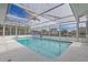 Enclosed pool area with a view of the canal and surrounding homes at 2000 Kansas Ne Ave, St Petersburg, FL 33703