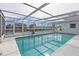 Enclosed rectangular pool with canal views at 2000 Kansas Ne Ave, St Petersburg, FL 33703