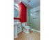 Bathroom with red vanity, shower, and tile floor at 8495 109Th St, Seminole, FL 33772