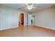 Bedroom with bathroom access and tile floors at 8495 109Th St, Seminole, FL 33772