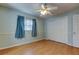 Well lit bedroom with wood floors and ceiling fan at 8495 109Th St, Seminole, FL 33772