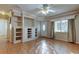 Living room with built-in shelving and tiled floors at 8495 109Th St, Seminole, FL 33772