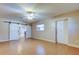 Spacious living room with tile floors and barn doors at 8495 109Th St, Seminole, FL 33772